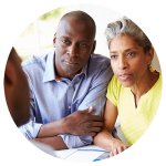 Black couple meeting with healthcare professional